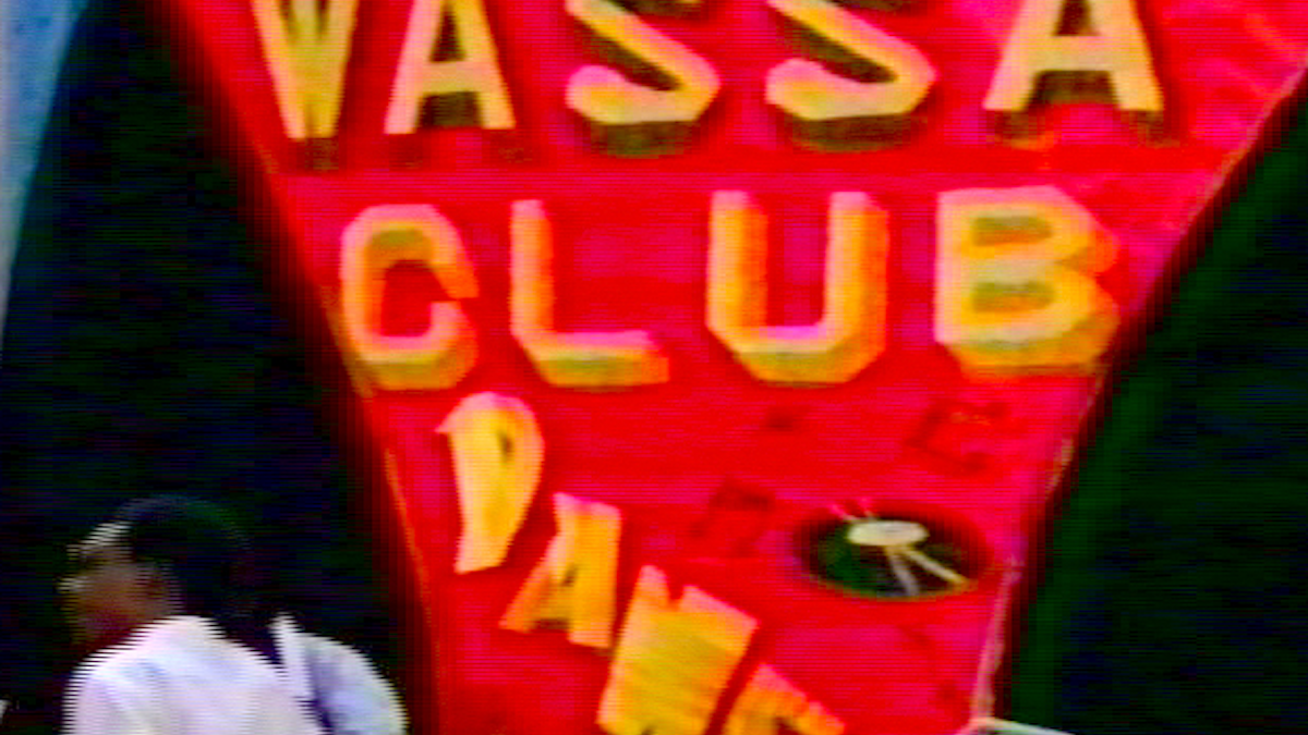 PHILIP MALLORY JONES, image of red sign that says "WASSA CLUB" with a record and music notes on it 