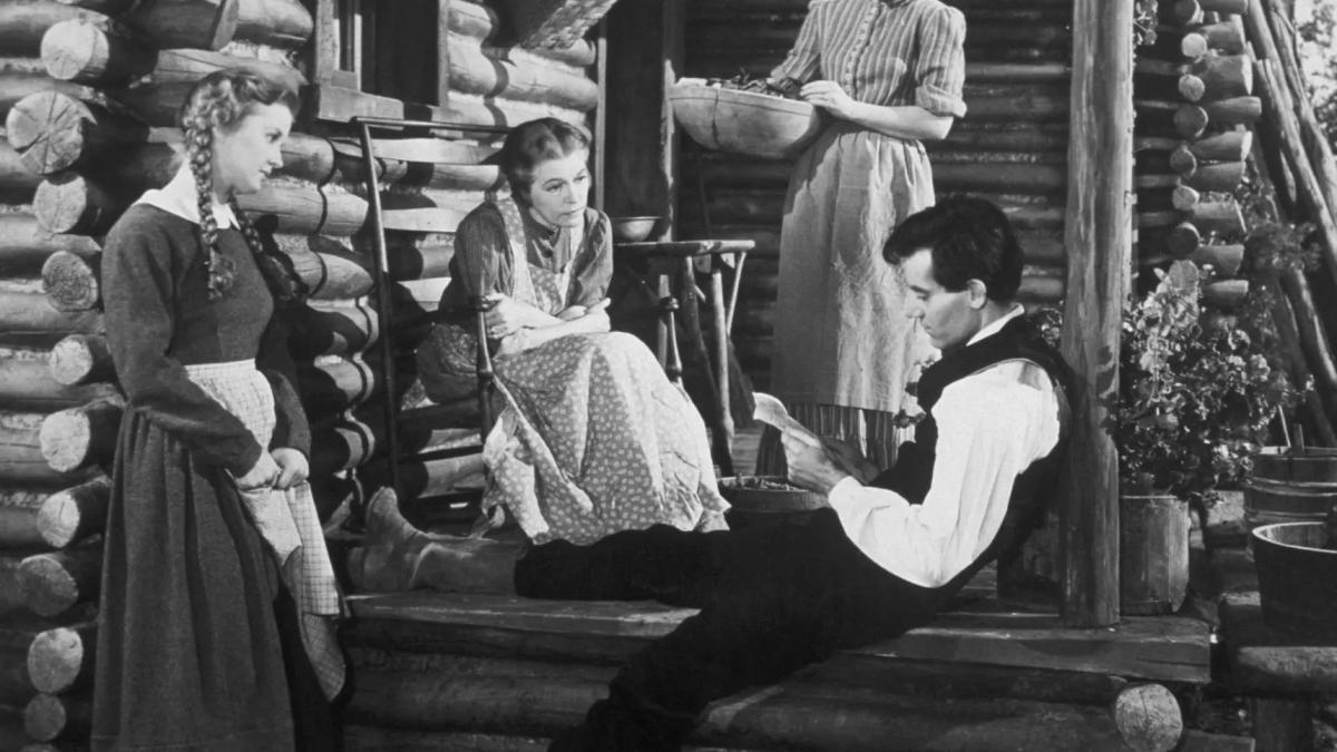 YOUNG MR. LINCOLN, 1939, black and white image of man and three woman seated outside of log cabin