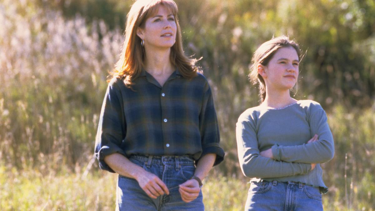 FLY AWAY HOME, 1996, woman and young girl standing on grassy hillside looking off into the distance