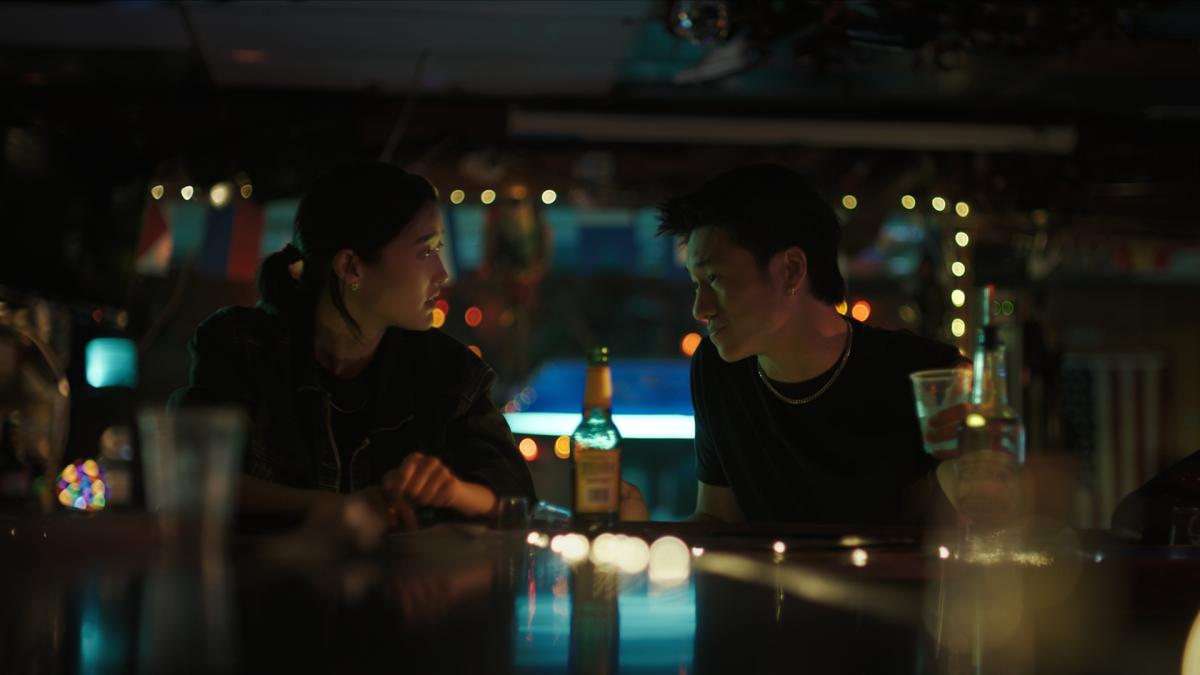 FORGE, 2025, two people seated across from each other at bar table with drinks