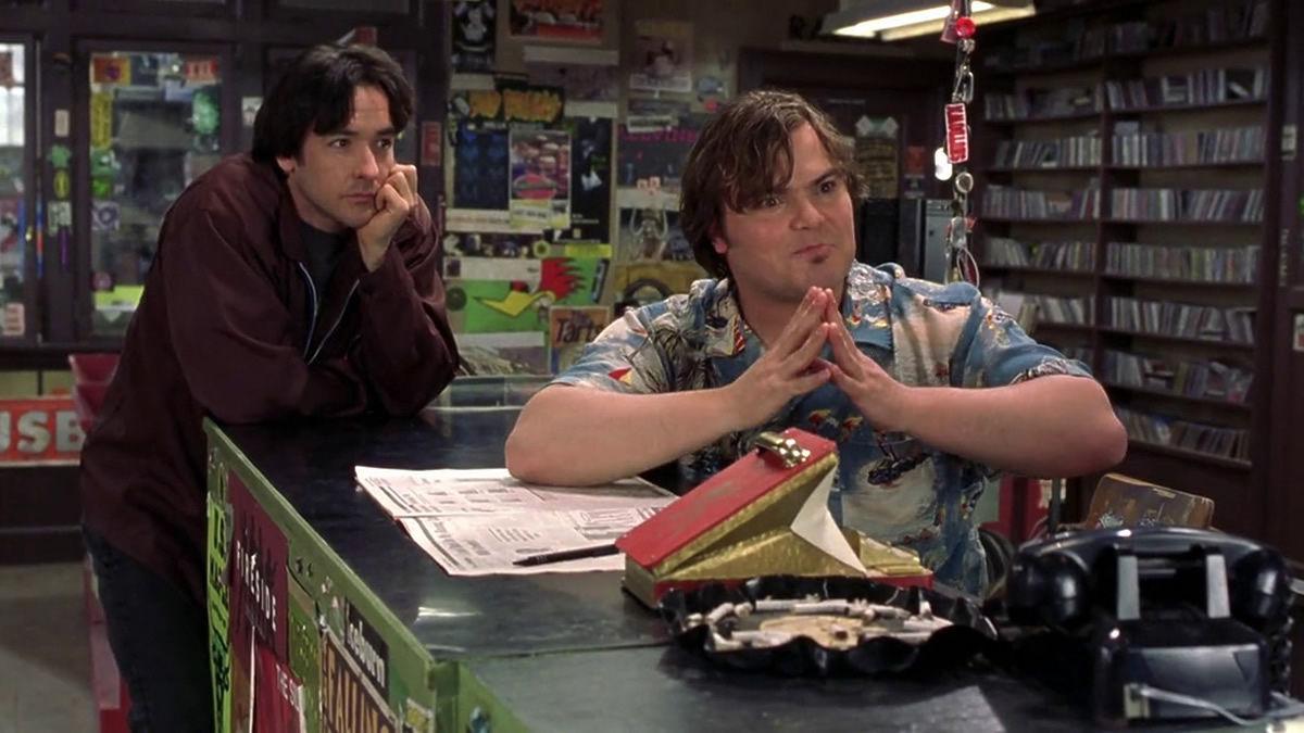 HIGH FIDELITY, 2000, John Cusack and Black Jack leaning over counter at record store