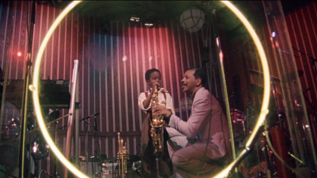 ORNETTE: MADE IN AMERICA, 1985, Black man and young boy in jazz recording studio