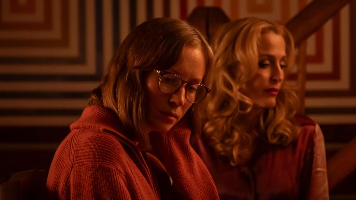 TEENAGE SEX AND DEATH AT CAMP MIASMA, 2026, two blonde girls in red-tinted light looking off into opposite directions