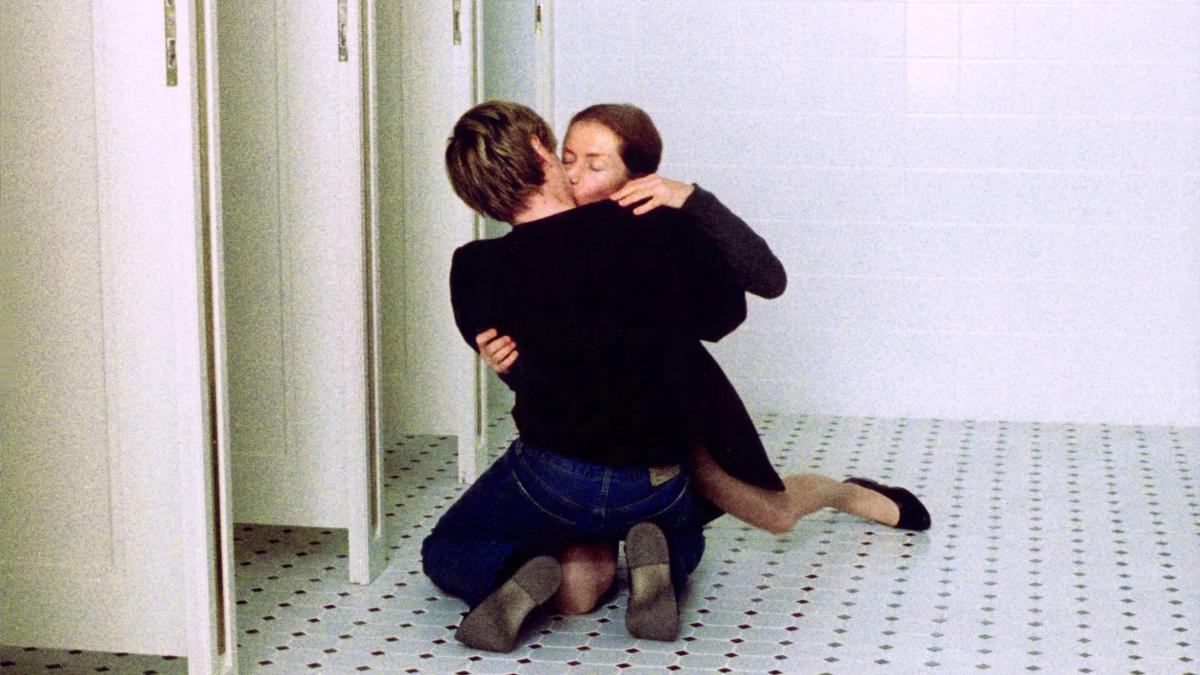 THE PIANO TEACHER, 2001, woman and man on bathroom floor in an embrace