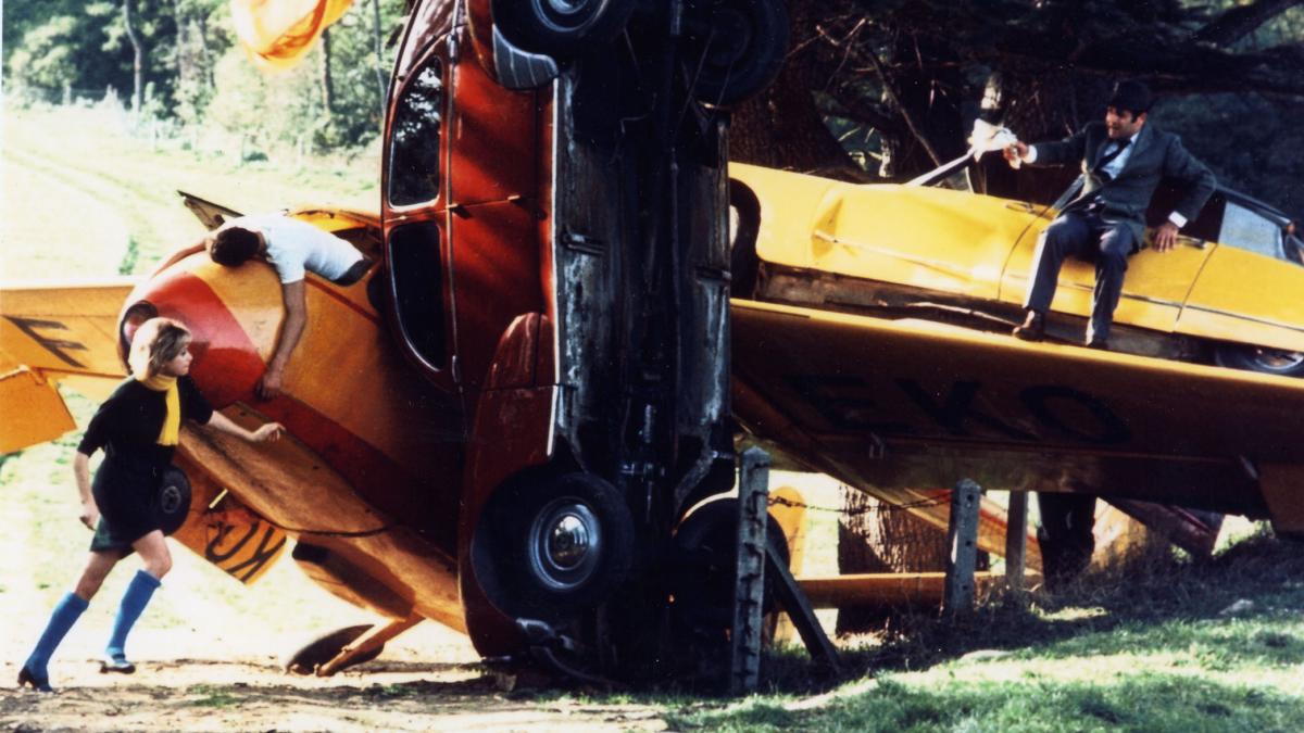 WEEKEND, 1968, several cars in a crash with man and woman on top and around tehm