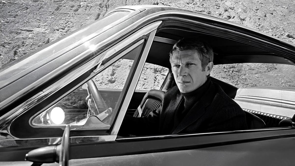 BULLITT, 1968, Steve McQueen driving car with arm leaning out of window