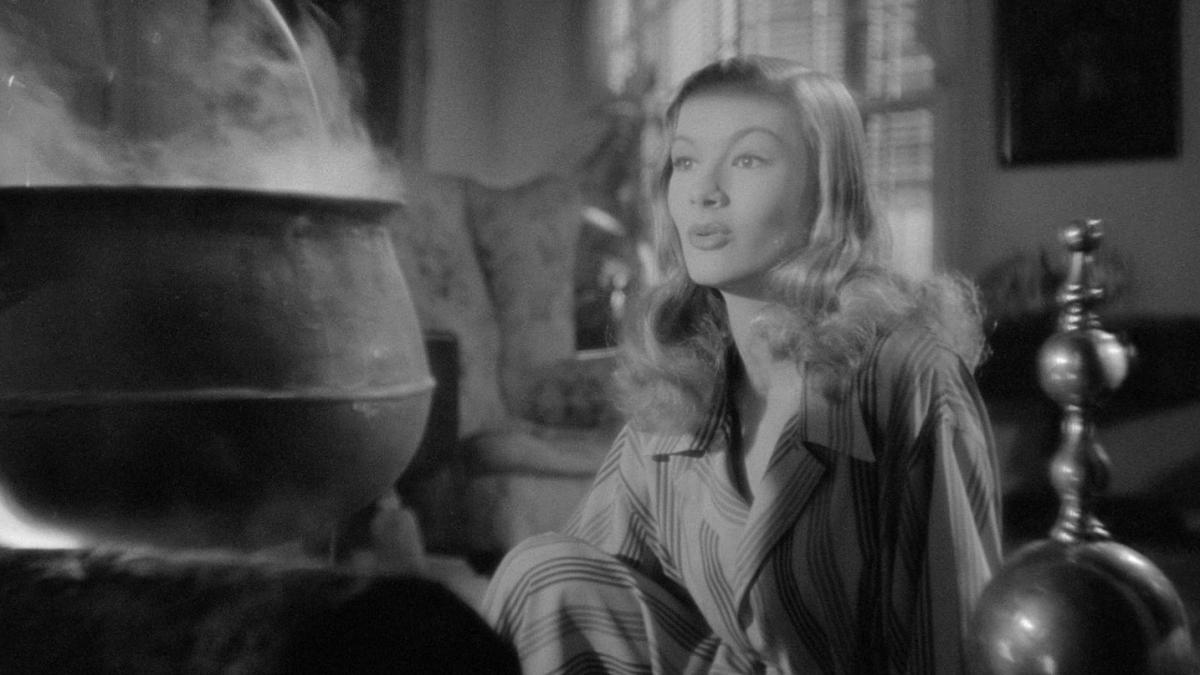 I MARRIED A WITCH, 1942, Veronica Lake leaning near boiling cauldron 
