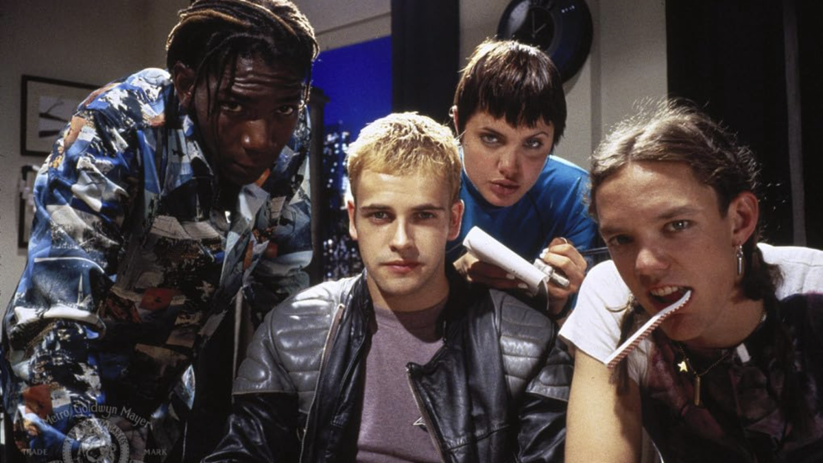 HACKERS, 1995, four young people gathered around looking into computer screen