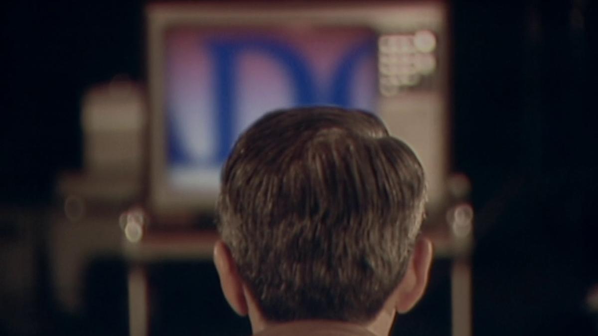 NO, 2012, back of young person's head watching television set