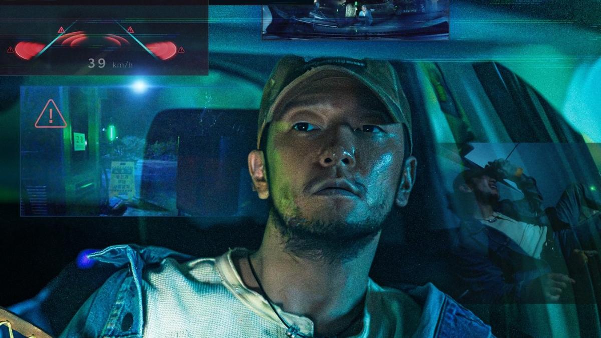 NIGHT FISHING, 2024, man in driver's seat of car at night holding fishing net