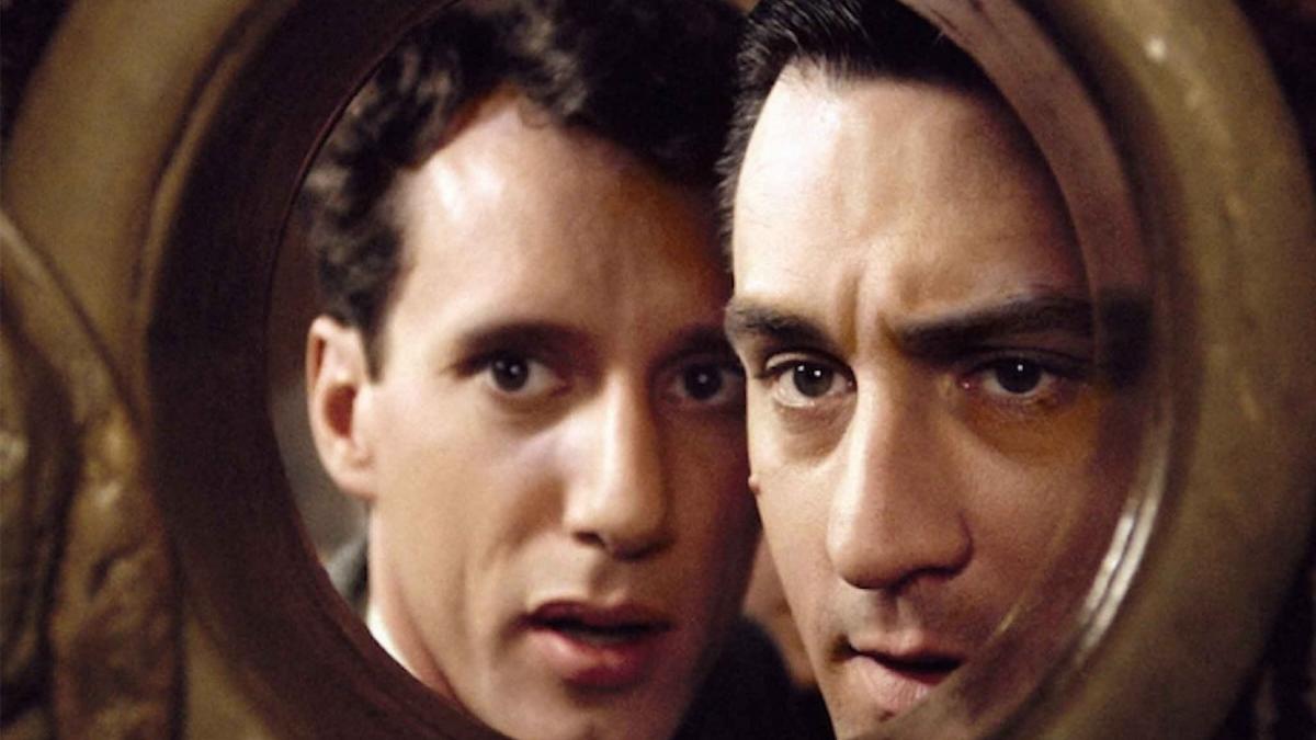 ONCE UPON A TIME IN AMERICA, 1984, two men peering through peephole in wall