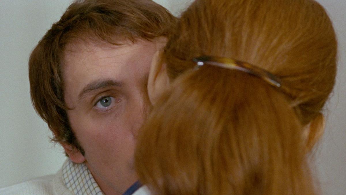 TEOREMA, 1968, man kissing woman with woman's head to back of camera
