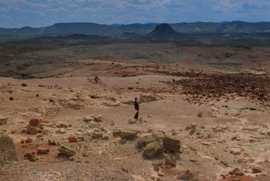 man walking in desert