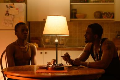 two men sitting at kitchen table
