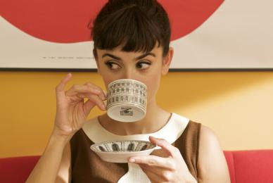 women sipping from tea cup