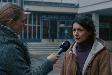woman news reporter interviewing woman outside