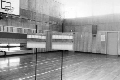 black and white basketball court with studio lights on court