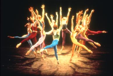 dancers on stage in leotards in circular formation