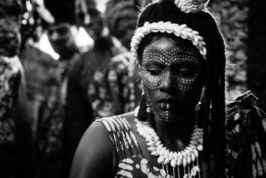 African woman with tribal jewelry and face paint